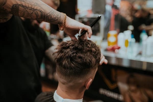 Clean fade haircut blended with precision at Chicho Barbershop